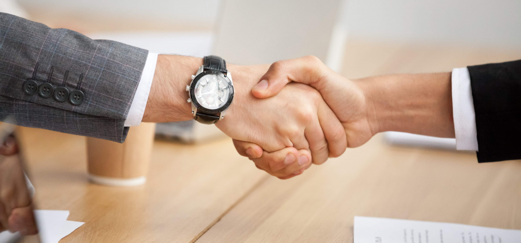 closeup-view-of-handshake-two-businessmen-in-suits-shaking-hands.jpg